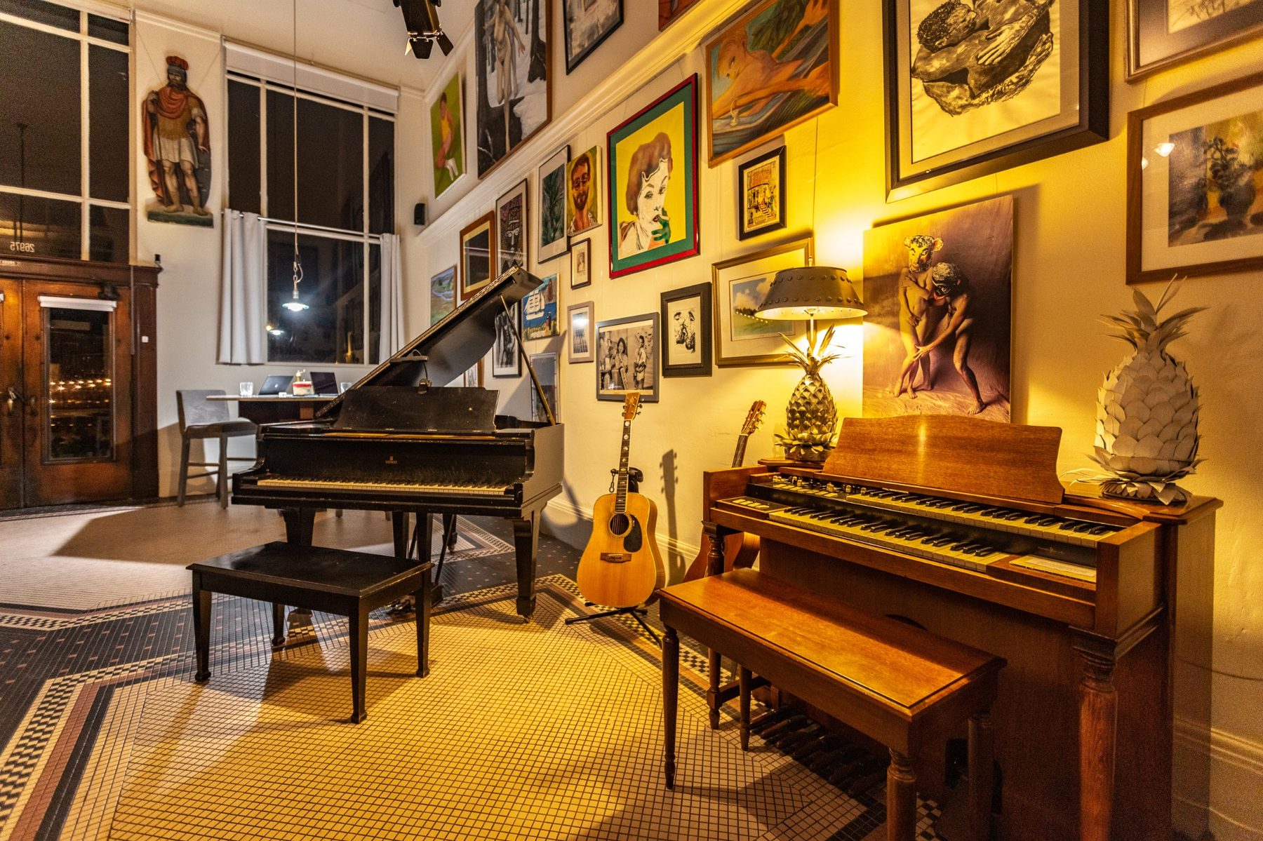 Grand piano, organ, guitars, and art inside Not A Bank